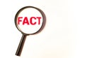 Hand Showing Facts Word Through Magnifying Glass Royalty Free Stock Photo