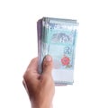 A hand showing Malaysian Ringgit
