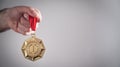 Hand showing medal. Sport, Winner, Success