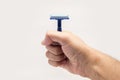 Hand showing a safety razor Royalty Free Stock Photo