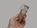 Hand Shown Holding an Empty Toilet Paper Cardboard Tube Royalty Free Stock Photo