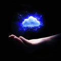 A glowing cloud icon floating above a person's hand with digital connections. Royalty Free Stock Photo