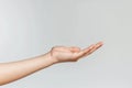 A hand is shown with a white background.Concept of openness and welcoming