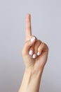 The hand shows the number one. Countdown gesture or sign. Sign language