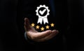 Hand shows the sign service Quality assurance 5 star, Guarantee, Standards, ISO certification and standardization concept Royalty Free Stock Photo