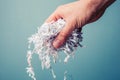 Hand with shredded paper Royalty Free Stock Photo