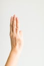 A hand sign with three fingers in scout meaning is swearing or s Royalty Free Stock Photo