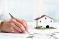 Hand signing real estate contract. Royalty Free Stock Photo