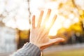 Hand silhouette against sunset The rays of the sun between your Royalty Free Stock Photo