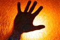 Hand Silhouette on Fire Orange Color Background