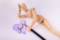 Hand sketched Purple Heart jointed doll laying by heart day dreaming