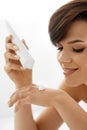 Hand Skin Care. Closeup Of Beautiful Woman Applying Cream Royalty Free Stock Photo