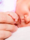 Hand the sleeping baby girl in the palm of mother Royalty Free Stock Photo