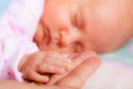Hand the sleeping baby girl in the palm of mother Royalty Free Stock Photo