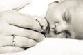 Hand the sleeping baby girl in the palm of mother Royalty Free Stock Photo