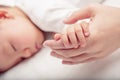 Hand the sleeping baby in the hand of mother close-up Soft focus and blurry Royalty Free Stock Photo