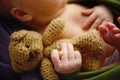 Hand of a sleeping newborn baby with fig sign for superstitious protection Royalty Free Stock Photo