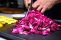 hand slicing fresh dragon fruit for addition in a smoothie