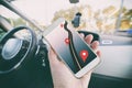 Hand with smartphone in a car Royalty Free Stock Photo