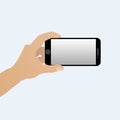 Hand with a smartphone horizontally