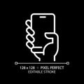 Hand with smartphone pixel perfect white linear icon for dark theme