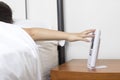 Hand snooze alarm clock in the morning Royalty Free Stock Photo