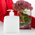 Hand soap with towel and flower