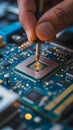 Hand soldering computer processor chip electronics Royalty Free Stock Photo