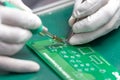 Hand soldering on green table