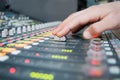 Hand on the sound desk Royalty Free Stock Photo