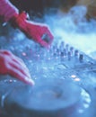 Hand on a sound mixer station Royalty Free Stock Photo