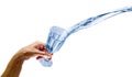 Hand splashing drinking water from glass