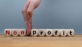 Hand splits the word `nonprofit` to `profiT