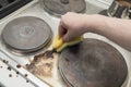 Hand with sponge removing coffee stains