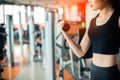 Hand of sports woman lifting dumbbell for weight training by hand for pumping biceps muscle with fitness gym background. Workout Royalty Free Stock Photo