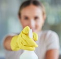 Hand, spray bottle and cleaning with a woman in gloves for housework or sanitization for hygiene. Hands, latex and