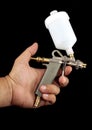 Hand and spray paint gun at work Royalty Free Stock Photo