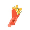 Hand with spring tulip bouquet