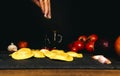 Hand sprinkling flour on fresh pasta. ingredients for pasta, tomato, onion, olive oil Royalty Free Stock Photo