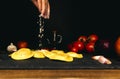 Hand sprinkling flour on fresh pasta. ingredients for pasta, tomato, onion, olive oil Royalty Free Stock Photo