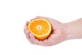 Hand squeeze ripe juicy orange. Royalty Free Stock Photo