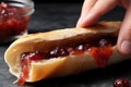 Hand Squeezing Jelly Tube Onto Bread. Generative AI