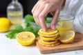 hand squeezing lemon onto vegan pancakes