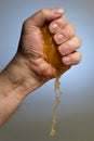 Hand Squeezing an Orange Royalty Free Stock Photo