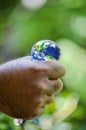 Hand squeezing planet earth Royalty Free Stock Photo