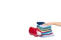 Hand with stack of clothes and detergent bottle, fresh laundry textile Royalty Free Stock Photo