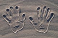 Hand stamp on the sand
