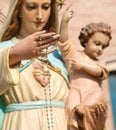 hand and the holy Mary and Baby Jesus Intentionally out of focus