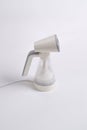 Hand steamer for clothes isolated on a white background Royalty Free Stock Photo