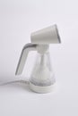 Hand steamer for clothes isolated on a white background Royalty Free Stock Photo